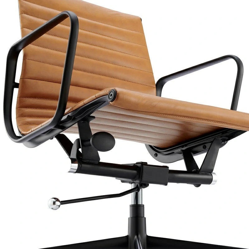Eames executive office chair   EA117 black Frame tan leather close up