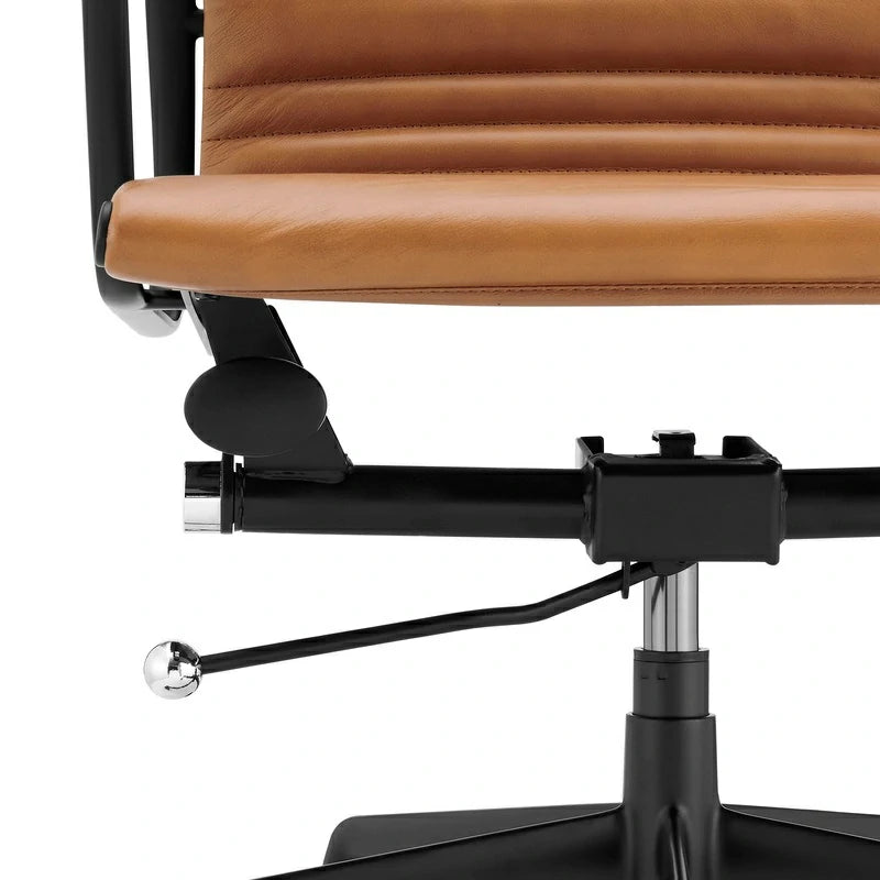 Eames executive office chair   EA117 black Frame tan leather close up