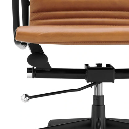 Eames executive office chair   EA117 black Frame tan leather close up